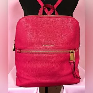 Michael Kors hot pink backpack purse.